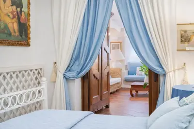 Letto o letti in una camera di Villa Junco