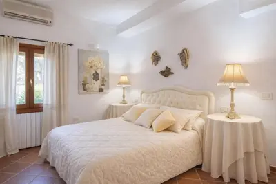 Letto o letti in una camera di Villa Junco