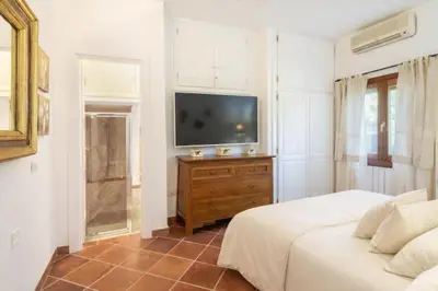 Letto o letti in una camera di Villa Junco