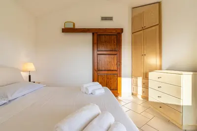 Letto o letti in una camera di EcoLux Pool Villa, Easy Access SouthSardiniaHolidays