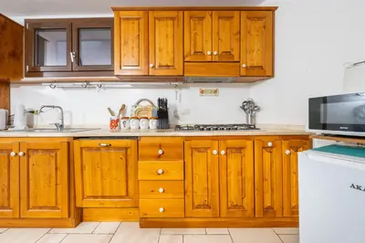 Cucina o angolo cottura di EcoLux Pool Villa, Easy Access SouthSardiniaHolidays