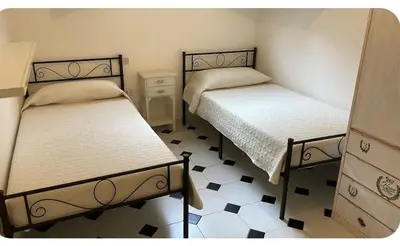 Letto o letti in una camera di Casa Micol