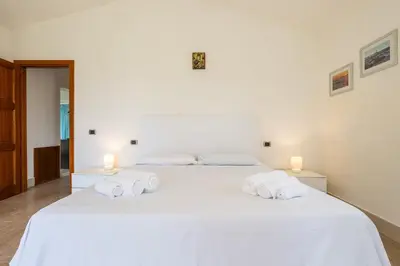 Letto o letti in una camera di Villa Chiara, Retreat SouthSardiniaHolidays