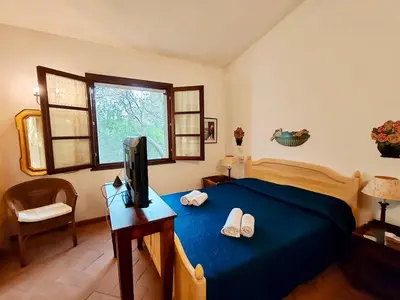 Letto o letti in una camera di Charming Cottage near Pula with Private Garden
