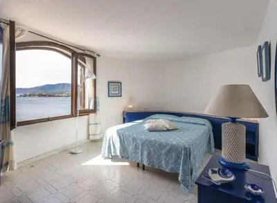 Letto o letti in una camera di Villa dei tramonti Torre delle Stelle