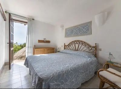 Letto o letti in una camera di Villa dei tramonti Torre delle Stelle