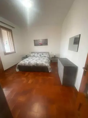 Letto o letti in una camera di Casa Liliana