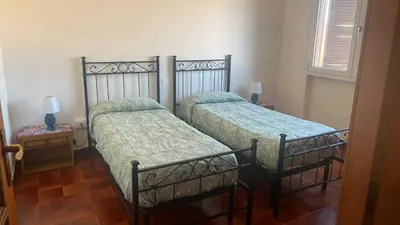 Letto o letti in una camera di Casa Liliana
