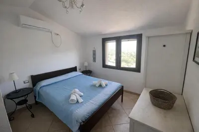 Letto o letti in una camera di Villa Rosa