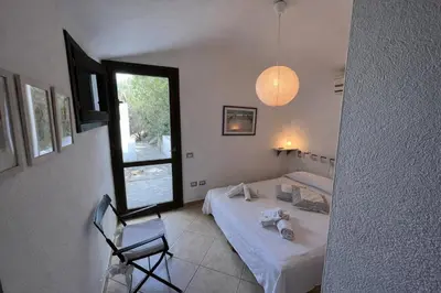 Letto o letti in una camera di Villa Rosa