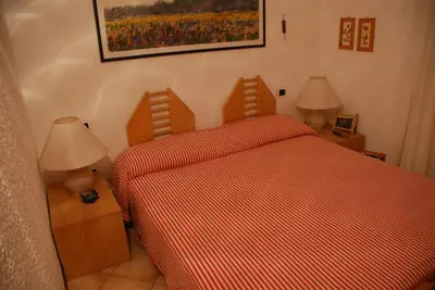 Letto o letti in una camera di Villa Rogio