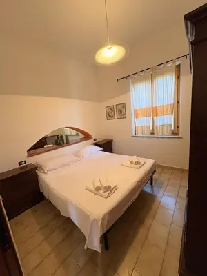 Letto o letti in una camera di Villa Irmā