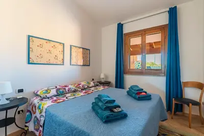 Letto o letti in una camera di Ri Ale Sa prassa