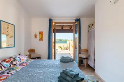 Letto o letti in una camera di Ri Ale Sa prassa