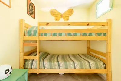 Letto o letti in una camera di Seaside Villa Near the Beach, Garden & BBQ