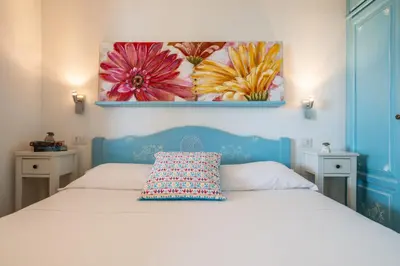 Letto o letti in una camera di Family Villa - 3 minuti dal Mare e Giardino Privato