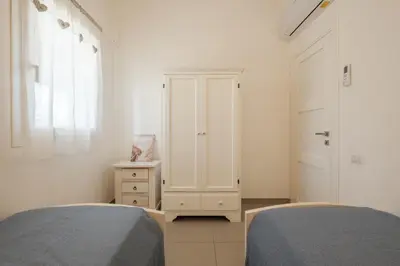 Letto o letti in una camera di Dreamy Villa - Elegante a 3 minuti a piedi dal Mare- wi-fi e parcheggio privato