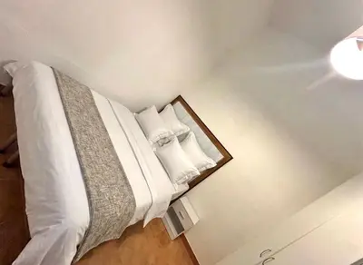 Letto o letti in una camera di QQMura house in centro
