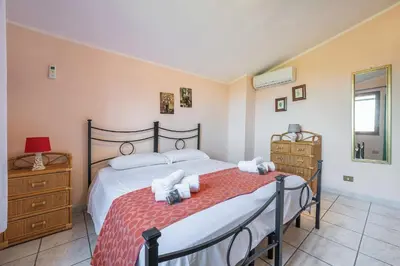 Letto o letti in una camera di Villetta Smeraldo, indipendente con giardino in zona residenziale