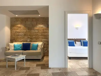 Letto o letti in una camera di Hotel Cala Caterina - Relaxing Escape