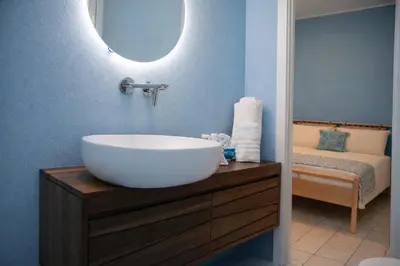 Letto o letti in una camera di Le Monachelle Luxury Apartment in Villasimius