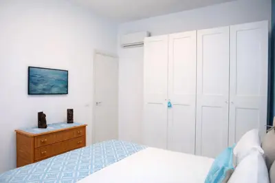 Letto o letti in una camera di Le Monachelle Luxury Apartment in Villasimius
