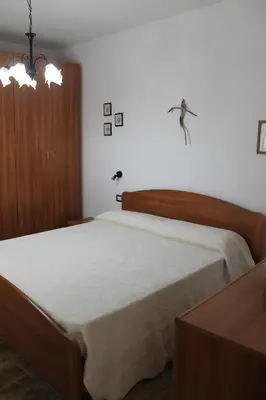 Letto o letti in una camera di Casa Carlotta