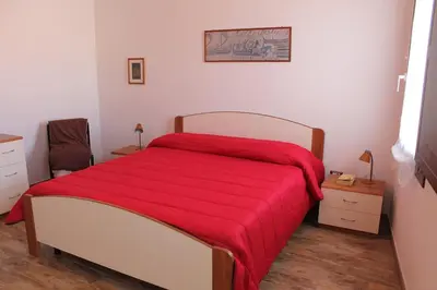 Letto o letti in una camera di Casa Carlotta