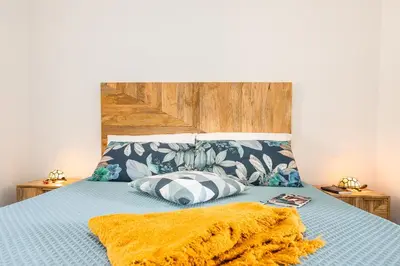 Letto o letti in una camera di Corte Luna Solanas Terrazza e Panorama Relax