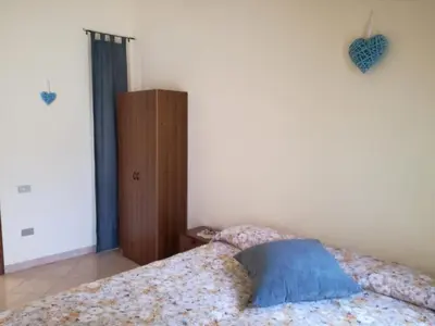 Letto o letti in una camera di Domu de Maria - Casa vacanza centralissima