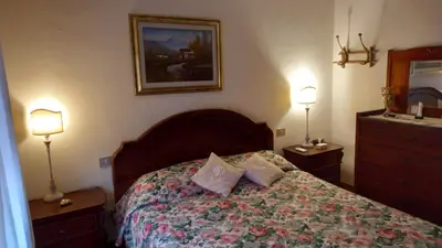 Letto o letti in una camera di Domu de Maria - Casa vacanza centralissima