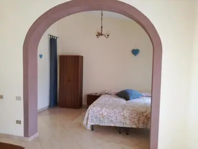 Letto o letti in una camera di Domu de Maria - Casa vacanza centralissima