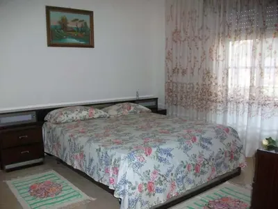 Letto o letti in una camera di Domu de Maria - Casa vacanza centralissima