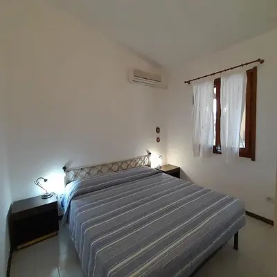 Letto o letti in una camera di Casamanno al mare Kala e Moru Geremeas