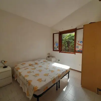 Letto o letti in una camera di Casamanno al mare Kala e Moru Geremeas