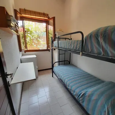 Letto o letti in una camera di Casamanno al mare Kala e Moru Geremeas