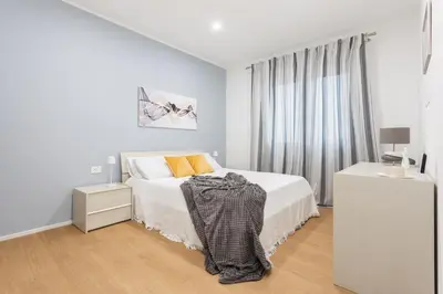 Letto o letti in una camera di Casa Bloom - Penthouse city-center view & Free Parking