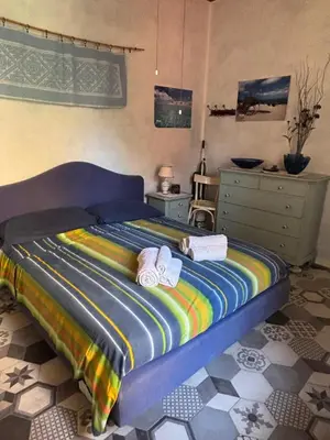 Letto o letti in una camera di Casa Vacanze a Teulada