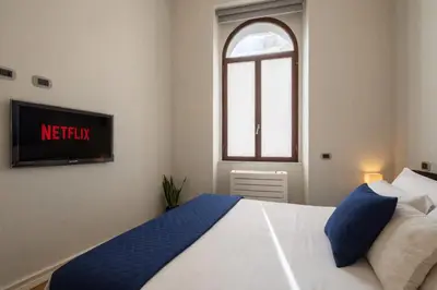 Letto o letti in una camera di Terrazza Privata- Eleganza mediterranea in Centro Città