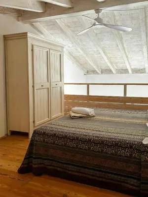 Letto o letti in una camera di Restored Stable Overlooking The Sea At Cova