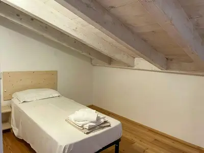 Letto o letti in una camera di Former Stable With Sea Access On San Pietro Island