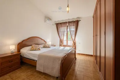 Letto o letti in una camera di Domo de Iannas
