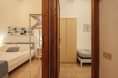 Letto o letti in una camera di Beach Family House 450m to the beach Torre delle Stelle
