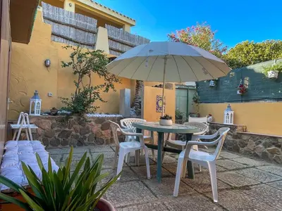 Patio o area all'aperto di Beach Family House 450m to the beach Torre delle Stelle