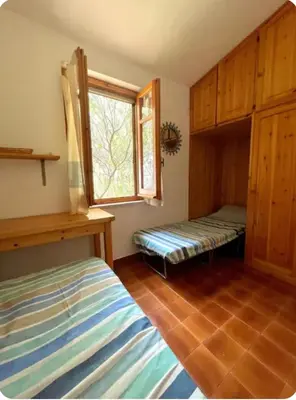 Letto o letti in una camera di Villa Marina