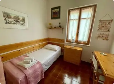 Letto o letti in una camera di Villa Marina