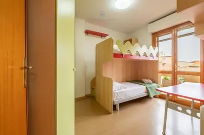Letto o letti in una camera di Domo Mea