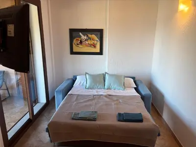 Letto o letti in una camera di Villino Giò - Residence Abba Urci