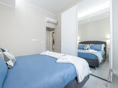 Letto o letti in una camera di Elegante appartamento Cagliari Centro