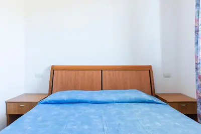 Letto o letti in una camera di GuestHost - Cozy Flat with Terrace by the Sea